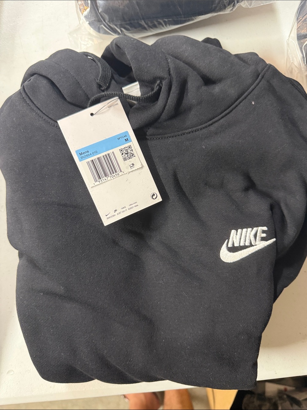 Nike Men's Black Hoodie with White Swoosh Size M